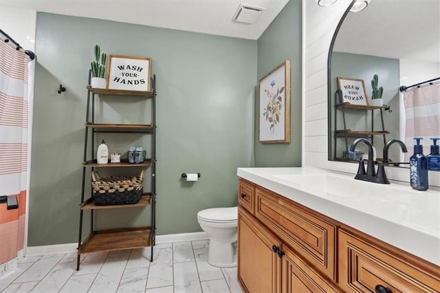 1803 N Jeter Rd, Raymore, MO 64083 - bathroom featuring marble finish floors, vanity, and a shower with shower curtain