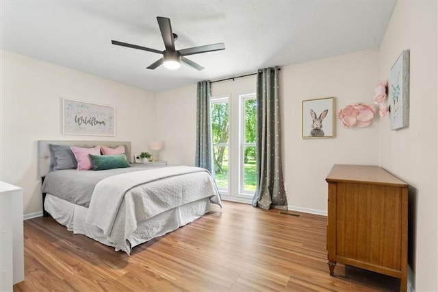 1803 N Jeter Rd, Raymore, MO 64083 - bedroom featuring light wood-style flooring and ceiling fan