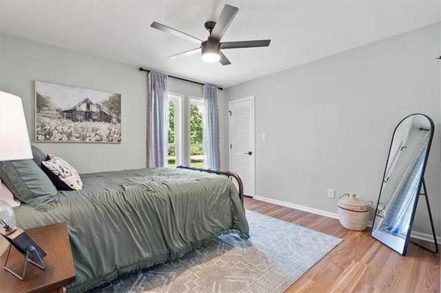 1803 N Jeter Rd, Raymore, MO 64083 - bedroom with wood finished floors and a ceiling fan
