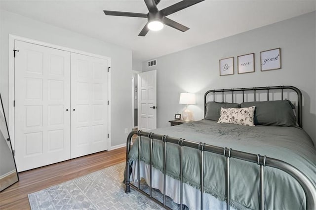 1803 N Jeter Rd, Raymore, MO 64083 - bedroom featuring wood finished floors, a closet, and ceiling fan