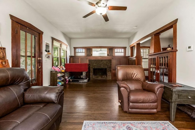 327 Parker Ave, Osawatomie, KS 66064 - living area with ceiling fan, wood finished floors, and a brick fireplace