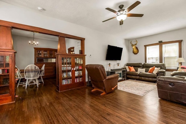 327 Parker Ave, Osawatomie, KS 66064 - living area featuring ceiling fan, a chandelier, and wood finished floors
