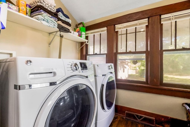 327 Parker Ave, Osawatomie, KS 66064 - laundry room featuring washing machine and dryer and wood finished floors