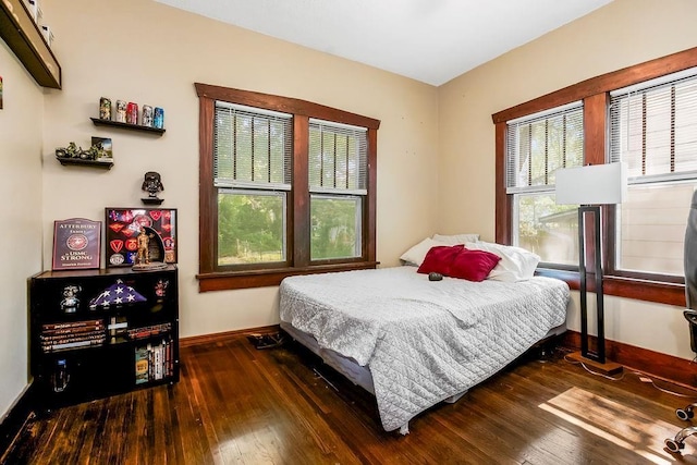 327 Parker Ave, Osawatomie, KS 66064 - bedroom featuring baseboards and wood-type flooring