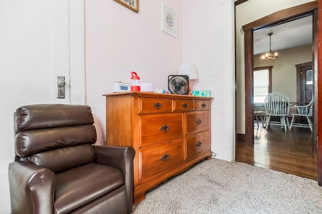 327 Parker Ave, Osawatomie, KS 66064 - living area with light colored carpet and a chandelier
