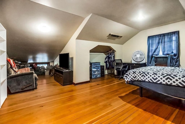 327 Parker Ave, Osawatomie, KS 66064 - bedroom with vaulted ceiling and wood-type flooring