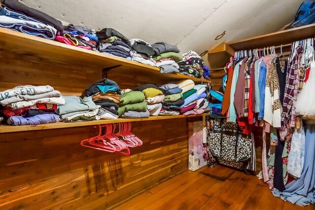 327 Parker Ave, Osawatomie, KS 66064 - spacious closet featuring wood finished floors and lofted ceiling