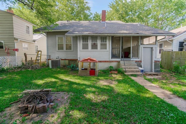 327 Parker Ave, Osawatomie, KS 66064 - rear view of property featuring a chimney, roof with shingles, and entry steps