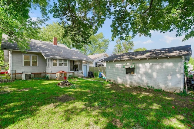 327 Parker Ave, Osawatomie, KS 66064 - back of property featuring a chimney and entry steps