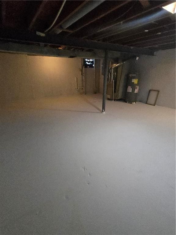 6302 E 120th Ter, Grandview, MO 64030 - unfinished basement featuring water heater