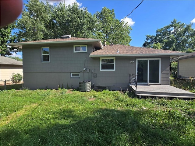 6302 E 120th Ter, Grandview, MO 64030 - back of property with a deck and roof with shingles