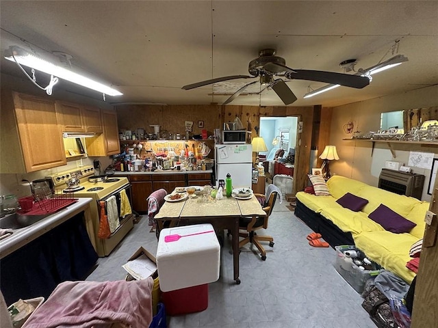 2332 Park Ln, Oak Grove, MO 64075 - kitchen with white appliances, a ceiling fan, and light flooring