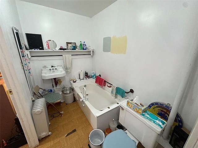 2332 Park Ln, Oak Grove, MO 64075 - bathroom with a whirlpool tub and radiator