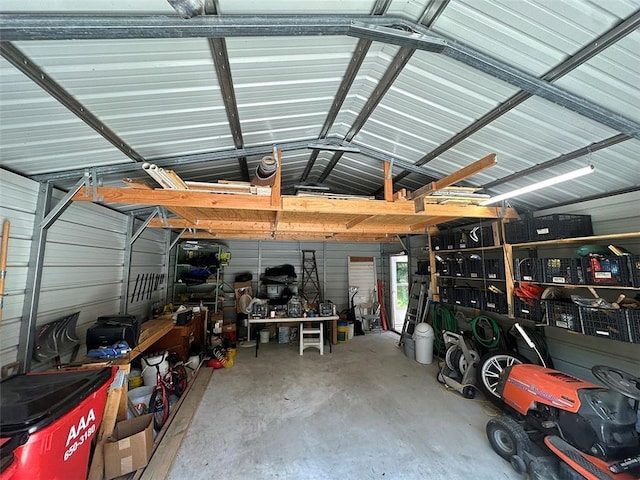 2332 Park Ln, Oak Grove, MO 64075 - garage featuring a workshop area and metal wall
