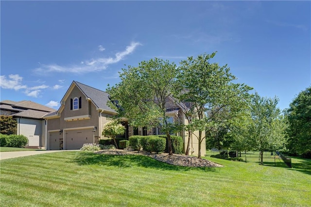 9445 W 157th Pl, Overland Park, KS 66221 - view of front of property with an attached garage, stucco siding, and driveway