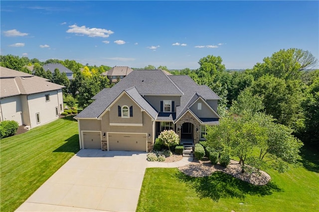 9445 W 157th Pl, Overland Park, KS 66221 - view of front facade with concrete driveway, stucco siding, a front lawn, an attached garage, and stone siding