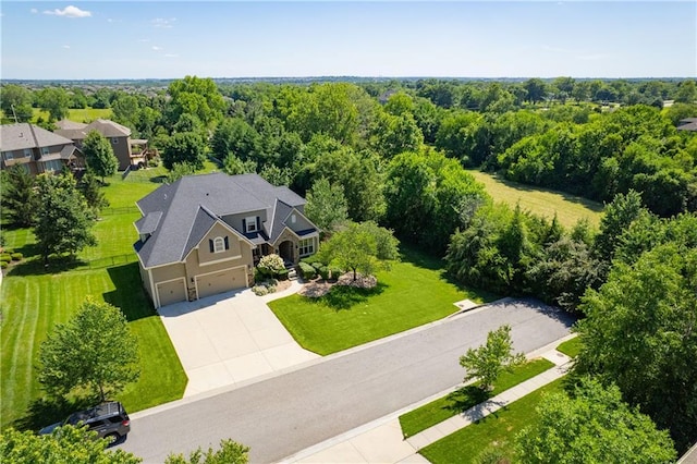 9445 W 157th Pl, Overland Park, KS 66221 - aerial view of property and surrounding area featuring a heavily wooded area