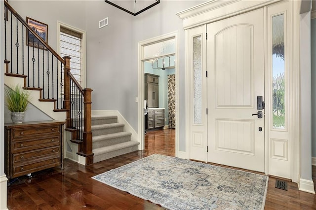9445 W 157th Pl, Overland Park, KS 66221 - foyer entrance with dark wood finished floors, stairs, and healthy amount of natural light