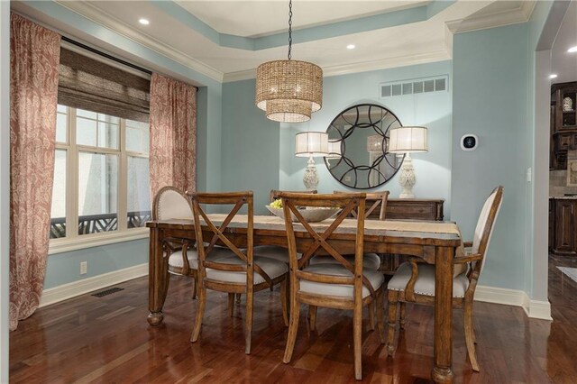 9445 W 157th Pl, Overland Park, KS 66221 - dining room with a chandelier, dark wood-style flooring, a tray ceiling, ornamental molding, and recessed lighting