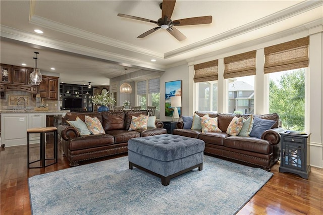 9445 W 157th Pl, Overland Park, KS 66221 - living area with wood finished floors, ornamental molding, ceiling fan, a tray ceiling, and recessed lighting