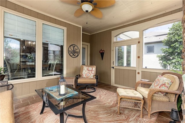 9445 W 157th Pl, Overland Park, KS 66221 - sunroom / solarium featuring a ceiling fan, healthy amount of natural light, wood walls, and crown molding