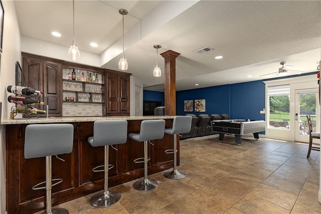 9445 W 157th Pl, Overland Park, KS 66221 - indoor dry bar featuring hanging light fixtures, decorative backsplash, billiards table, decorative columns, and recessed lighting