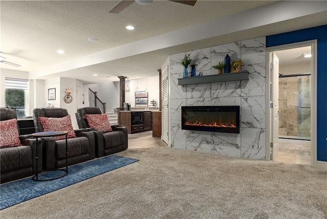 9445 W 157th Pl, Overland Park, KS 66221 - living area featuring ceiling fan, light colored carpet, a high end fireplace, recessed lighting, and stairs
