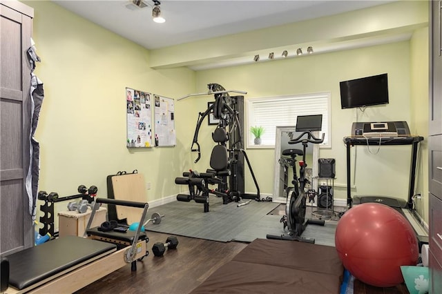 9445 W 157th Pl, Overland Park, KS 66221 - workout area with baseboards and wood finished floors