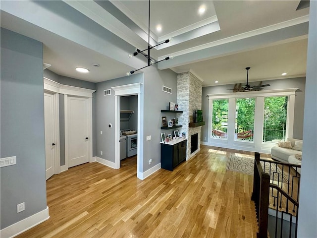 5443 N 101st Ter, Kansas City, KS 66109 - living room featuring ceiling fan, light wood-type flooring, a stone fireplace, ornamental molding, and recessed lighting