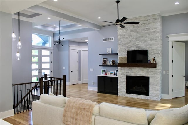5443 N 101st Ter, Kansas City, KS 66109 - living area with ornamental molding, a ceiling fan, a fireplace, wood finished floors, and recessed lighting