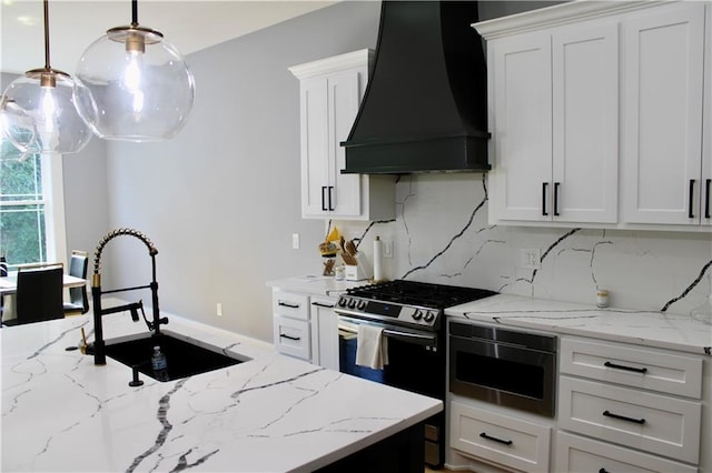 5443 N 101st Ter, Kansas City, KS 66109 - kitchen with custom range hood, stainless steel gas range oven, decorative backsplash, white cabinetry, and light stone counters
