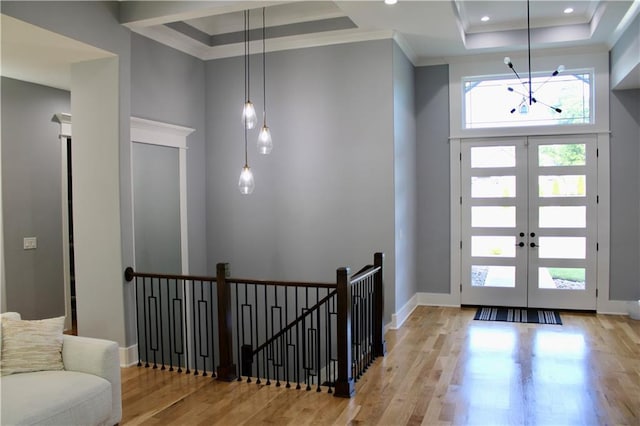 5443 N 101st Ter, Kansas City, KS 66109 - foyer with a raised ceiling, wood finished floors, a chandelier, ornamental molding, and recessed lighting