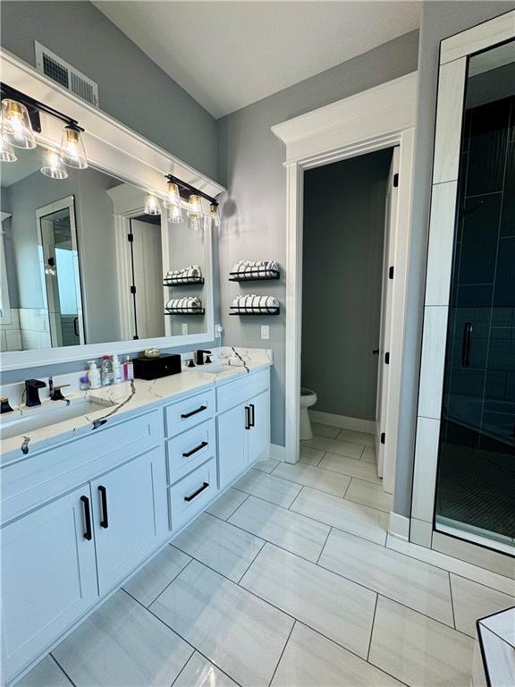 5443 N 101st Ter, Kansas City, KS 66109 - full bathroom with double vanity and a shower stall