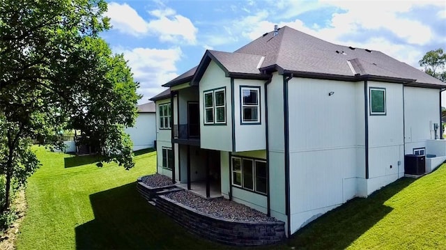 5443 N 101st Ter, Kansas City, KS 66109 - view of side of home featuring a lawn and a central AC unit