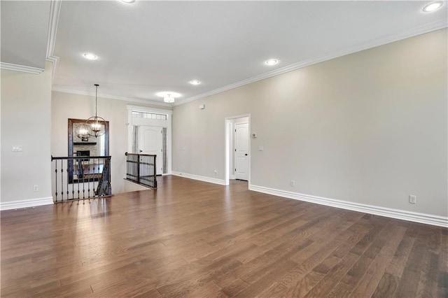 3912 SW Odell Dr, Lees Summit, MO 64082 - unfurnished living room featuring dark wood-style floors, crown molding, and recessed lighting