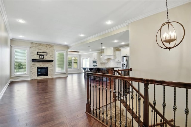 3912 SW Odell Dr, Lees Summit, MO 64082 - living area with plenty of natural light, a chandelier, dark wood finished floors, crown molding, and recessed lighting