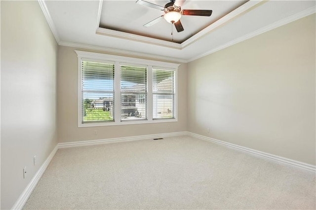 3912 SW Odell Dr, Lees Summit, MO 64082 - carpeted empty room with a raised ceiling, ornamental molding, and ceiling fan
