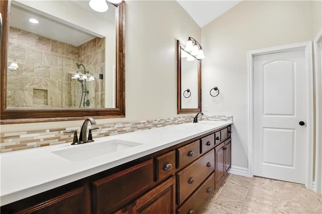 3912 SW Odell Dr, Lees Summit, MO 64082 - bathroom with double vanity, backsplash, vaulted ceiling, and tiled shower