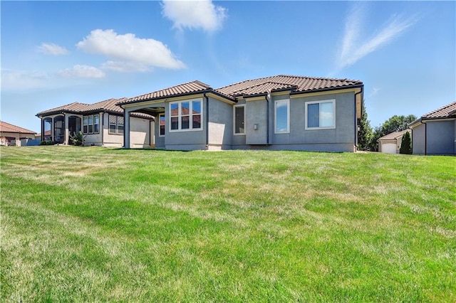 3912 SW Odell Dr, Lees Summit, MO 64082 - back of property with a tile roof, a yard, and stucco siding