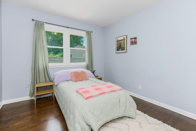 3006 S 39th St, Kansas City, KS 66106 - bedroom featuring dark wood-type flooring and baseboards