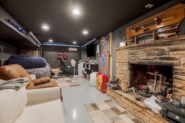 3006 S 39th St, Kansas City, KS 66106 - home theater with concrete floors, recessed lighting, and a stone fireplace