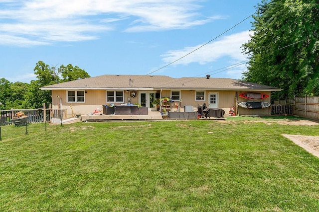 3006 S 39th St, Kansas City, KS 66106 - rear view of property featuring a hot tub, a fenced backyard, and a deck