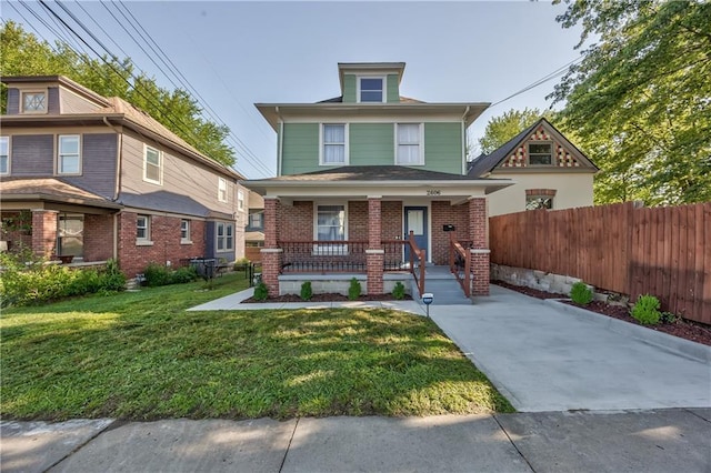 2606 Smart Ave, Kansas City, MO 64124 - american foursquare style home with covered porch and brick siding