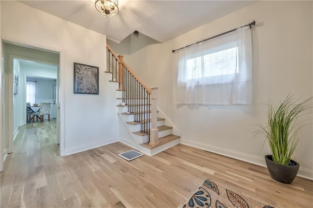 2606 Smart Ave, Kansas City, MO 64124 - staircase featuring wood finished floors and healthy amount of natural light