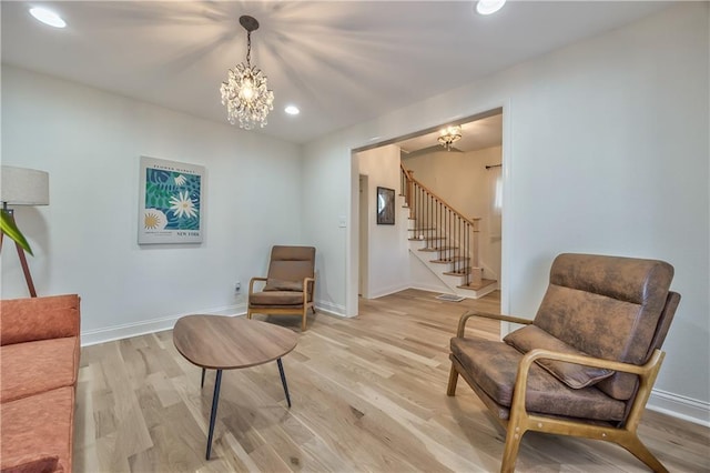 2606 Smart Ave, Kansas City, MO 64124 - sitting room with a chandelier, stairs, light wood-style floors, and recessed lighting