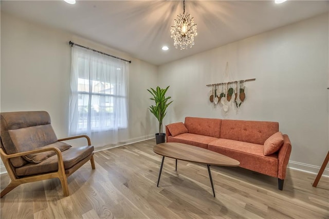 2606 Smart Ave, Kansas City, MO 64124 - living area featuring light wood-style floors, a chandelier, and recessed lighting