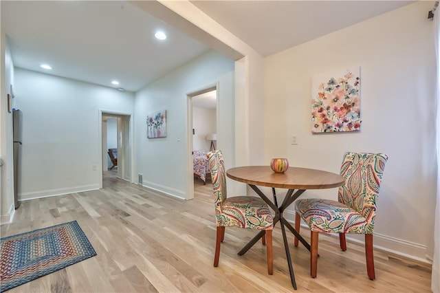 2606 Smart Ave, Kansas City, MO 64124 - dining room featuring light wood-style floors and recessed lighting