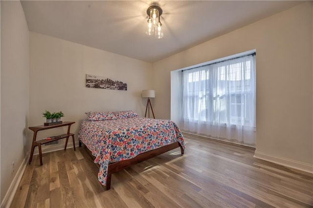 2606 Smart Ave, Kansas City, MO 64124 - bedroom featuring wood finished floors and baseboards
