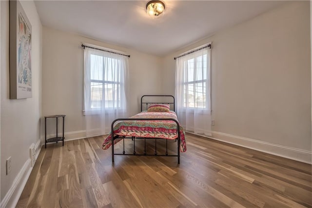 2606 Smart Ave, Kansas City, MO 64124 - bedroom with wood finished floors and baseboards
