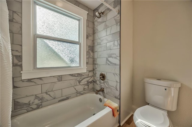 2606 Smart Ave, Kansas City, MO 64124 - bathroom featuring healthy amount of natural light and shower / tub combination